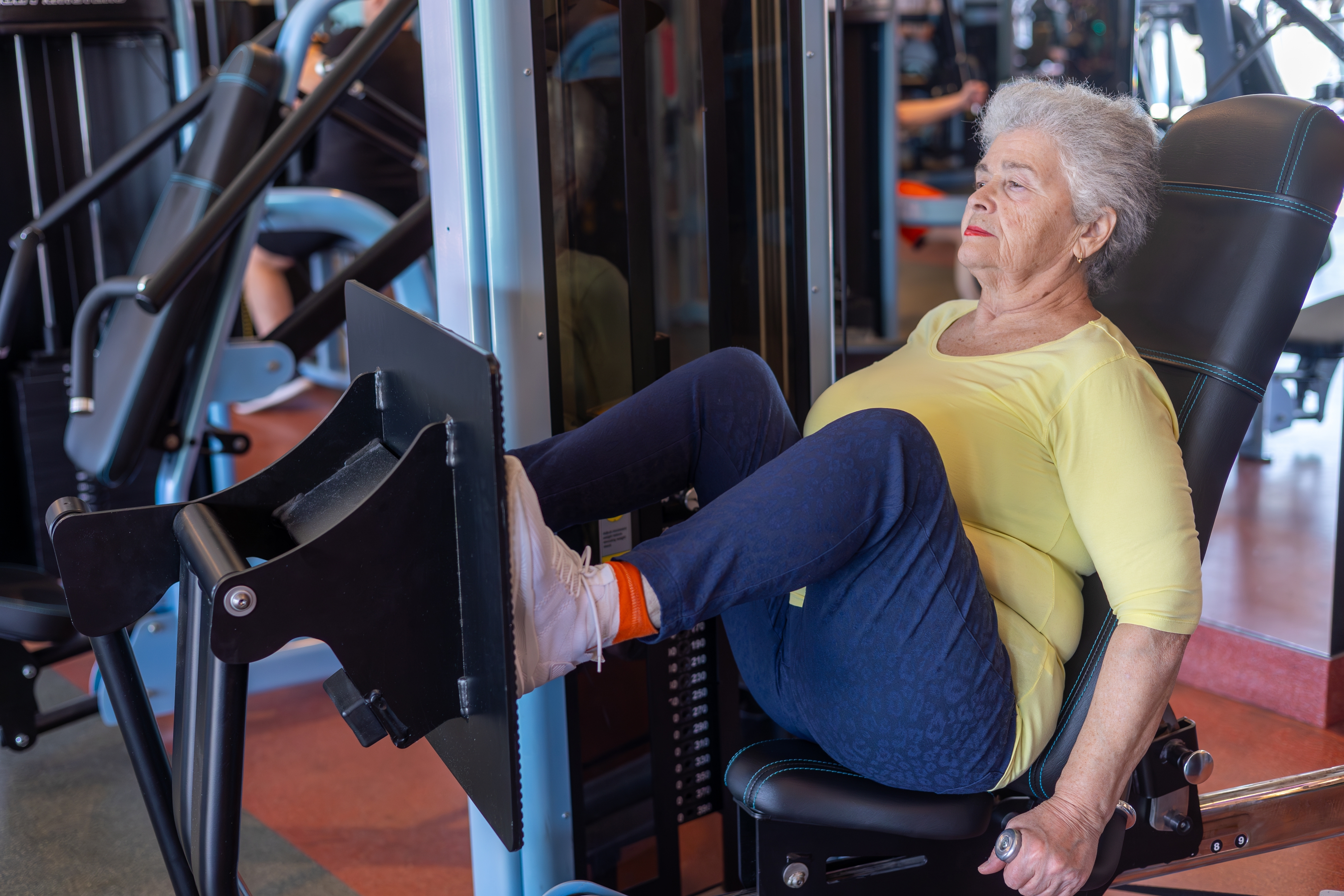 Senior Women using leg press machine